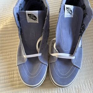 Vans Sk8-Hi sneakers in a lavender/blue colorway with a logo mix pattern.